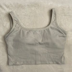 Ribbed creamish grey colored crop exercise top